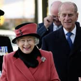 Queen Elizabeth II and Prince Phillip visit the Thomas Bennett Community College in Crawley, to commemorate the town's 60th anniversary. (Photo credit GARETH FULLER/AFP via Getty Images)