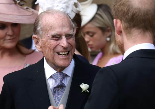 Britain's Prince Philip, Duke of Edinburgh reacts as he talks with Britain's Prince Harry, Duke of Sussex as they leave St George's Chapel in Windsor Castle, Windsor, west of London, on May 18, 2019, after the wedding of Lady Gabriella Windsor and Thomas Kingston (Photo by STEVE PARSONS/POOL/AFP via Getty Images) SUS-210904-131933001