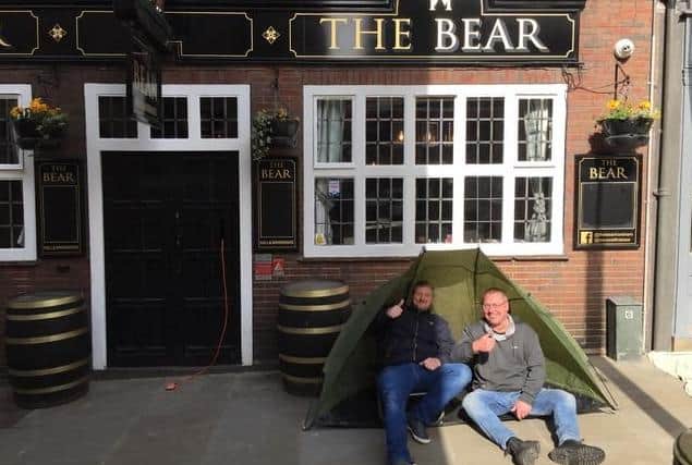 Chris Cole, left, and John Pettit camped out waiting for 'banter with the boys' to return