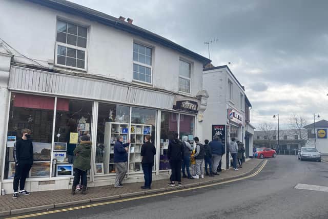 Queues outside New Style barbers in Pier Road, Littlehampton today (April 12)
