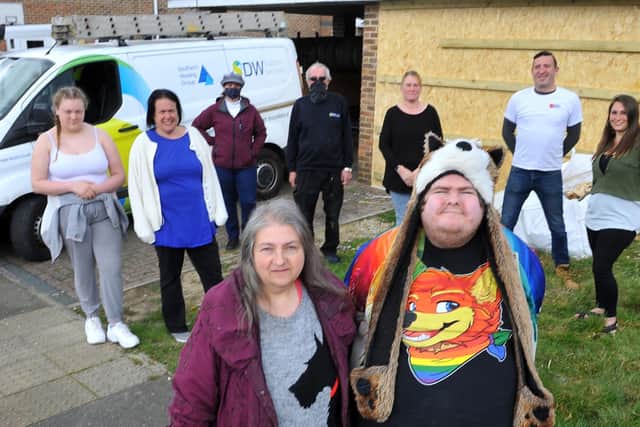 Amanda Duffy and her son Ashley with neighbours and members of the local community. Picture by Steve Robards