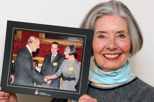 Lilian Holdsworth, Deputy Lieutenant for West Sussex, holding a photo of her with the Duke of Edingburgh. Picture: Derek Martin Photography