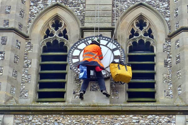 Clock repairs at St John's Church in Meads. Picture by Sue Lockhart. SUS-210414-155112001