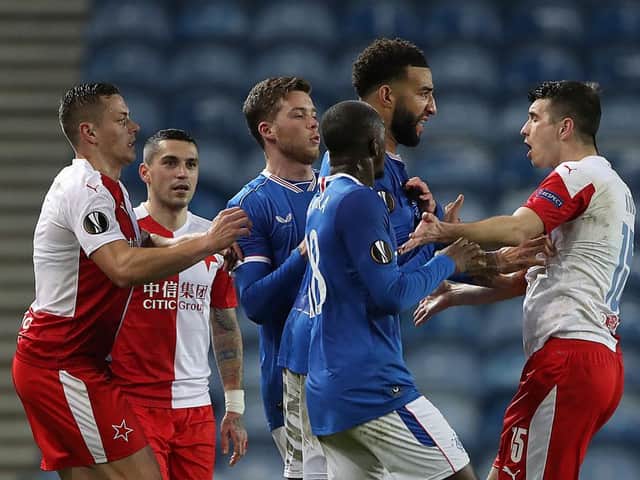 Rangers players clash with Ondrej Kudela of Slavia Prague during the UEFA Europa League Round of 16 Second Leg match at Ibrox