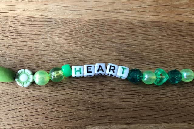 A 'heart' bracelet made in the iconic green of Tyler's Trust