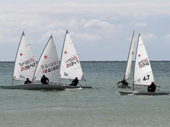 Lasers in close quarters racing for the first mark off Hastings and St Leonards Club / Photo by Rick Pryce