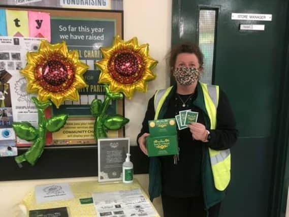 Louise Coffey, the community champion at Morrisons in St James Street, with some of the seeds
