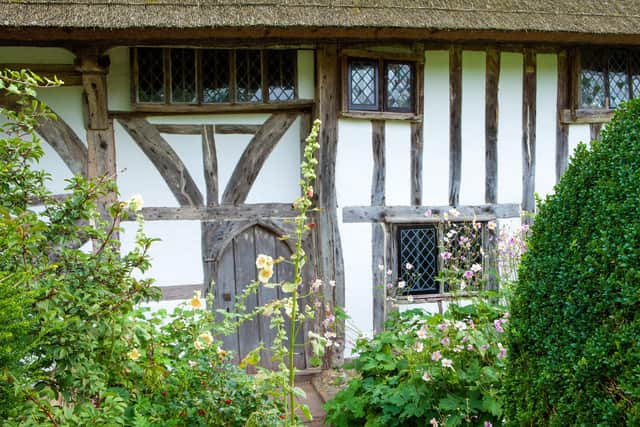The half-timbered exterior wall of Alfriston Clergy House, East Sussex. A rare 14th-century Wealden hall-house set in a traditional garden. National Trust Images_Marianne Majerus SUS-190710-123835001