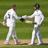 Stiian van Zyl is congratulated on his ton by George Garton as Sussex build a big lead / Picture: Getty