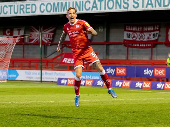 Jordan Maguire-Drew celebrates the only goal of Crawley's clash with Cheltenham / Picture: Jamie Evans - UK Sports Images