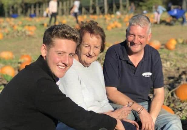 Stuart Beare, right, with his son Sam and mother Marion at Tulleys Farm, during a Pick Your Own Pumpkin event