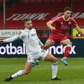Crawley Town defender Nick Tsaroulla shoots past Leeds United's Kalvin Phillips to open the scoring in the FA Cup third round. Picture by Glyn Kirk/AFP via Getty Images