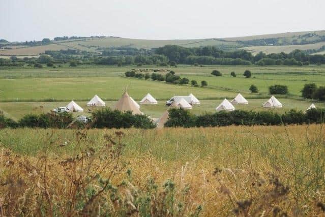 Tipis and tents in the field