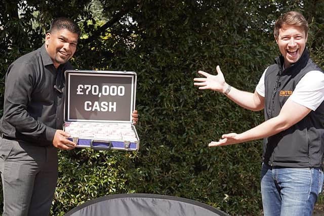 From left: Dixon Xavier with his cash prize and BOTB presenter Christian Williams