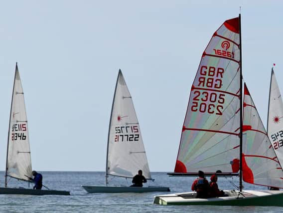 Winners of the three race handicap, Margaret and Philip Blurton, sail their Tasar in the foreground. Photo: Rick Pryce