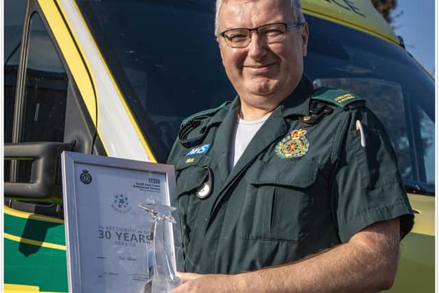 Paramedic Neil Martin received a 30-year service award