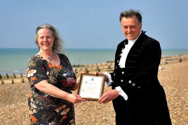 Communities champion Elaine Hammond accepts the award for JPIMedia's West Sussex journalists from High Sheriff of West Sussex Dr Tim Fooks. Picture: Steve Robards SR2104211