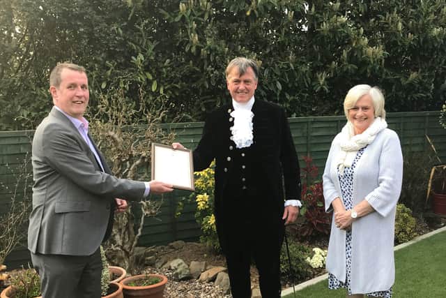 Martin Auton-Lloyd, chief executive, and Alyson Heath, chairman of trustees, are presented with the award for Family Support Work for their work across Sussex with vulnerable and isolated families