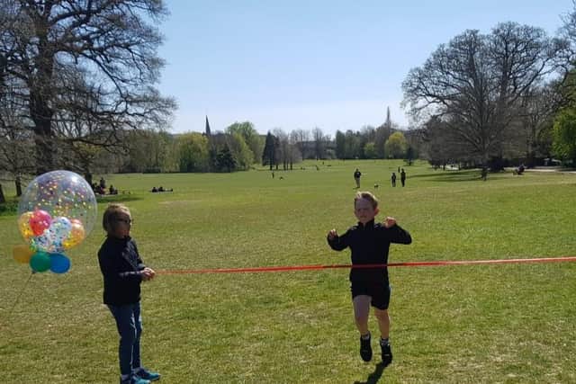 Tem-year-old Scott Bradley from Horsham completed his running challenge for UNICEF five days ahead of schedule SUS-210427-143222001