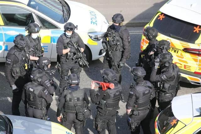 Armed police outside the college