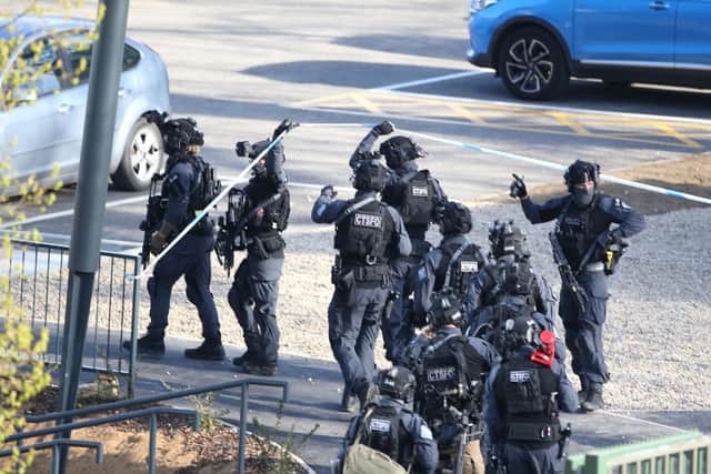 Armed  police at the scene at Crawley College on Monday
