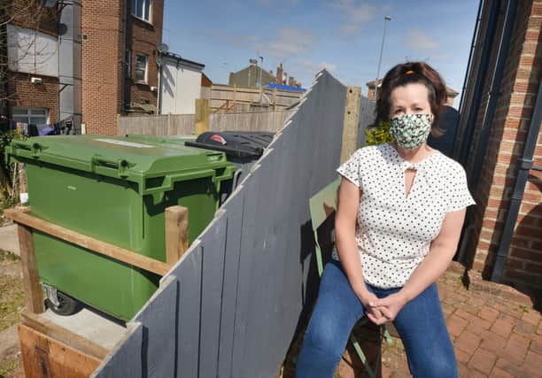 Picture shows how close the bins are to Diane Darby's fence and garden area, Mildenhall Drive, St Leonards. SUS-210426-123623001