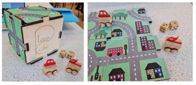 The Burgess Hill Academy team have designed a wooden play cube containing toy cars, which turns into a play road map for children SUS-210430-124545001