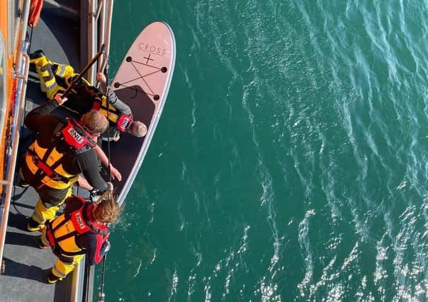 Bringing the paddle board in. Photo: RNLI/Rob ‘Archie’ Archibald
