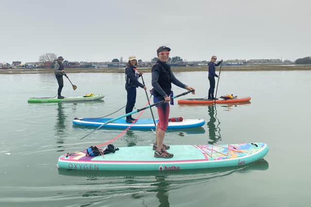 Paddle boarding instructors on the River Adur for the All On Board course led by expert ornithologist Tony Benton