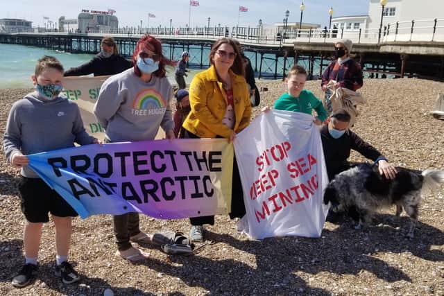 Greenpeace protesters at Worthing Pier SUS-210428-102217001