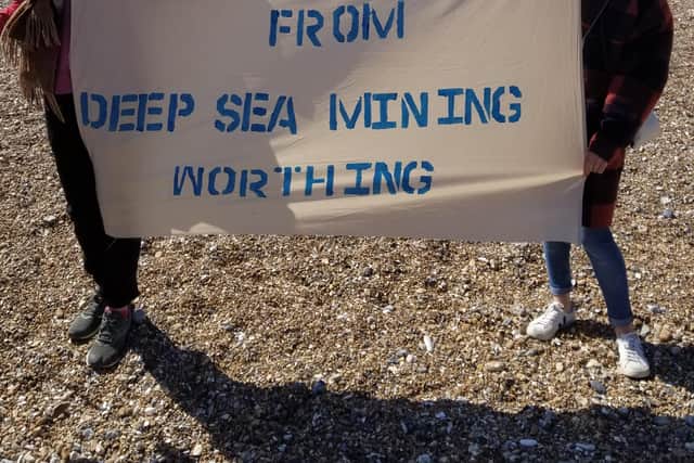 Greenpeace protesters at Worthing Pier SUS-210428-102240001