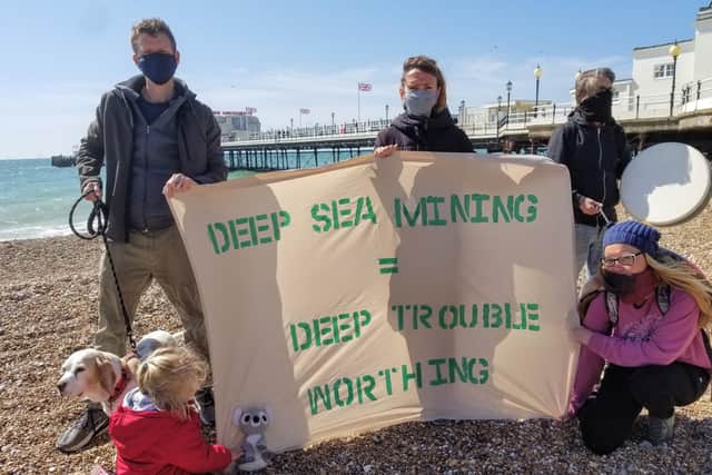 Greenpeace protesters at Worthing Pier SUS-210428-102320001