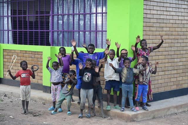 Children celebrate the opening of a new centre