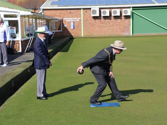 The mayor, Cllr Lionel Harman, bowls the first bowl at Worthing Pavilion