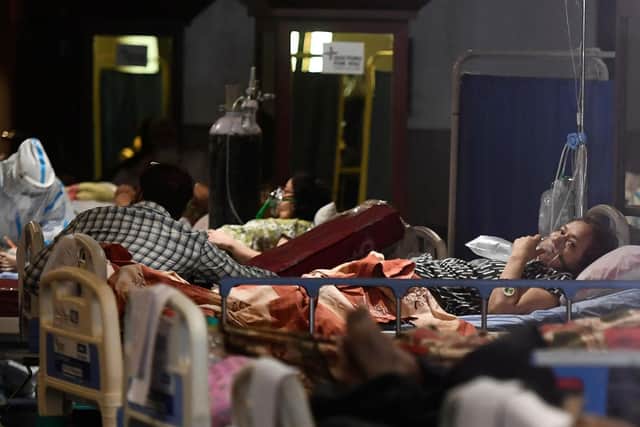 Coronavirus patients rest inside a banquet hall temporarily temporarily converted into a coronavirus ward in New Delhi on April 29. Picture by Tauseef Mustafa/AFP via Getty Images