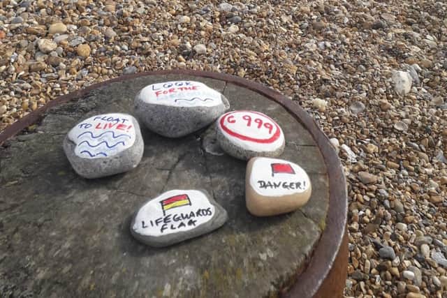 Some of the secret stones the fire service has left on Eastbourne Beach. SUS-210429-163526001