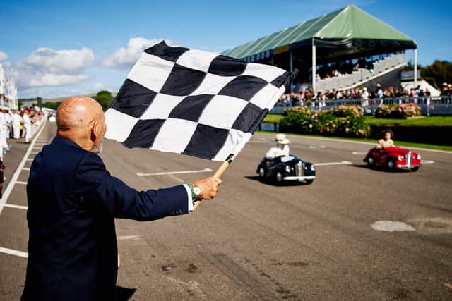Sir Stirling Moss waves the chequered flag at Goodwood Revival's Settrington Cup in 2016 - Photo by Dominic James