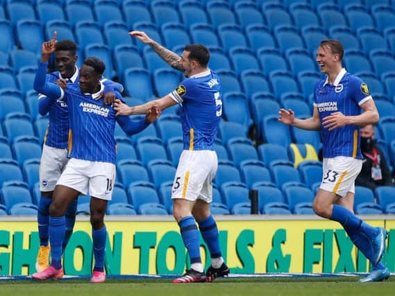 Brighton players celebrate a vital victory against Leeds United at the Amex Stadium