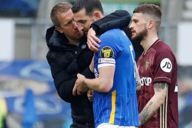 Graham Potter congratulates Lewis Dunk after his performance against Leeds United at the Amex Stadium on Saturday