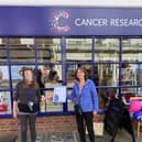 Janice Smith, assistant manager, Cancer Research UK East Street and Trish Law, volunteer, being presented with her Flame of Hope certificate for raising so much money and awareness.