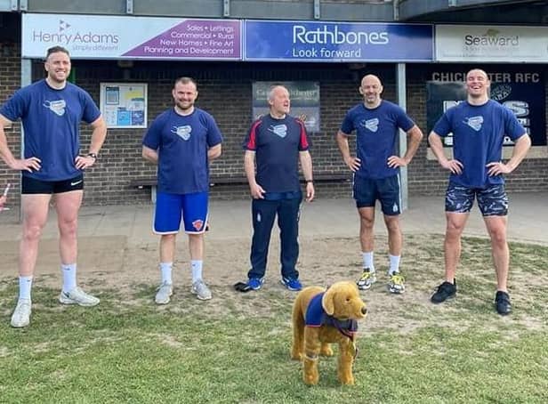 Nick Blout, Tommy Polhill, Chichester Rugby Club 1st XV manager Alan Chambers, Ben Polhill and Aaron Davies with the Hounds for Heroes mascot