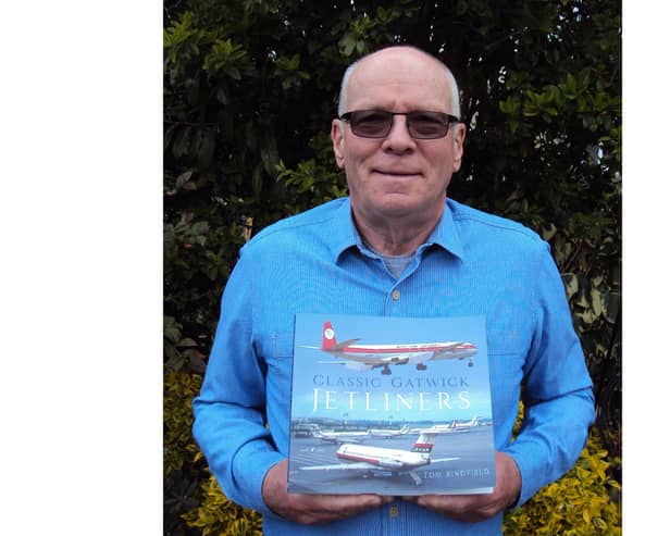 Horsham author Tom Singfield with his latest book about aviation SUS-210505-120143001