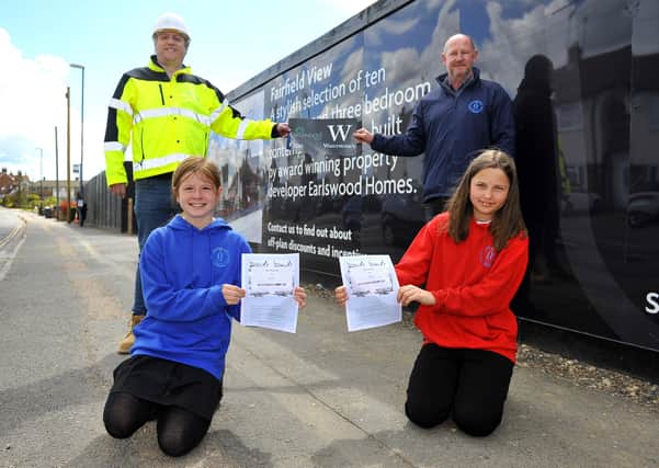 Earlswood Homes construction and commercial director James Chase with Southway Junior School headteacher Peter Newbold, contest winner Isla Adams and her friend Zuzia Cytowicz. Picture by Steve Robards