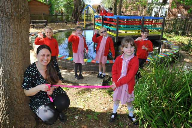 Headteacher Sally Dreckmann with pupils at Rose Green Infant school, Bognor Regis with their refurbished pond. Pic S Robards SR2105101 SUS-211005-145427001