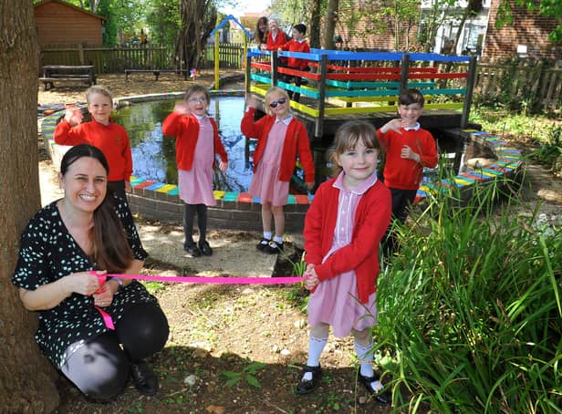 Headteacher Sally Dreckmann with pupils at Rose Green Infant school, Bognor Regis with their refurbished pond. Pic S Robards SR2105101 SUS-211005-145427001