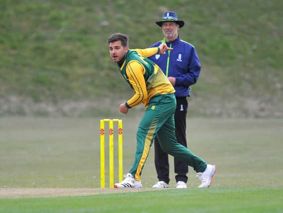 Jonny Phelps bowling for Haywards Heath CC in their T20 Cup clash with Three Bridges CC on Saturday. Picture by Steve Robards