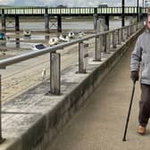 John Morgan, a retired GP, is walking 100 times around Ropetackle in Shoreham to raise money for Crisis