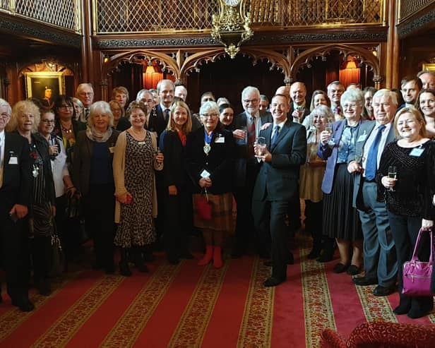 Guests and members of West Sussex Mediation Service receiving the Queen's Award at Arundel Castle SUS-191113-095113001