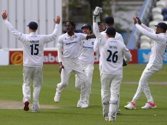 Jofra Archer celebrates with his Sussex teammates after dismissing Zak Crawley on day one of Kent's visit to Hove / Picture: Getty