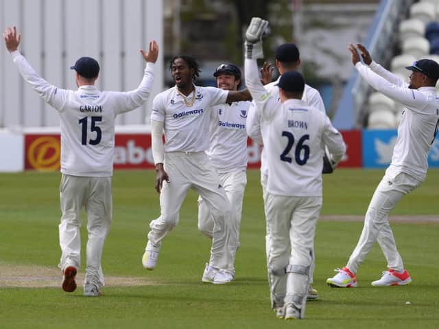 Jofra Archer celebrates with his Sussex teammates after dismissing Zak Crawley on day one of Kent's visit to Hove / Picture: Getty
